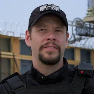 Ike Barinholtz as Griggs in Suicide Squad