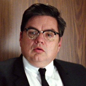 Oliver Platt as Man in the Black Suit in X-Men: First Class