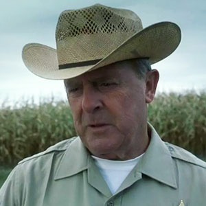 Peter MacNeill as Sheriff Sam Carney