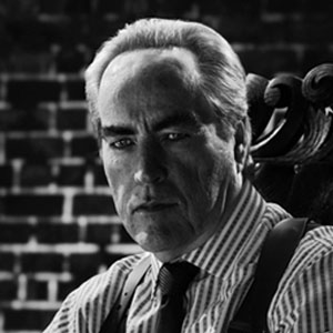 Powers Boothe as Senator Roark in Sin City: A Dame to Kill For